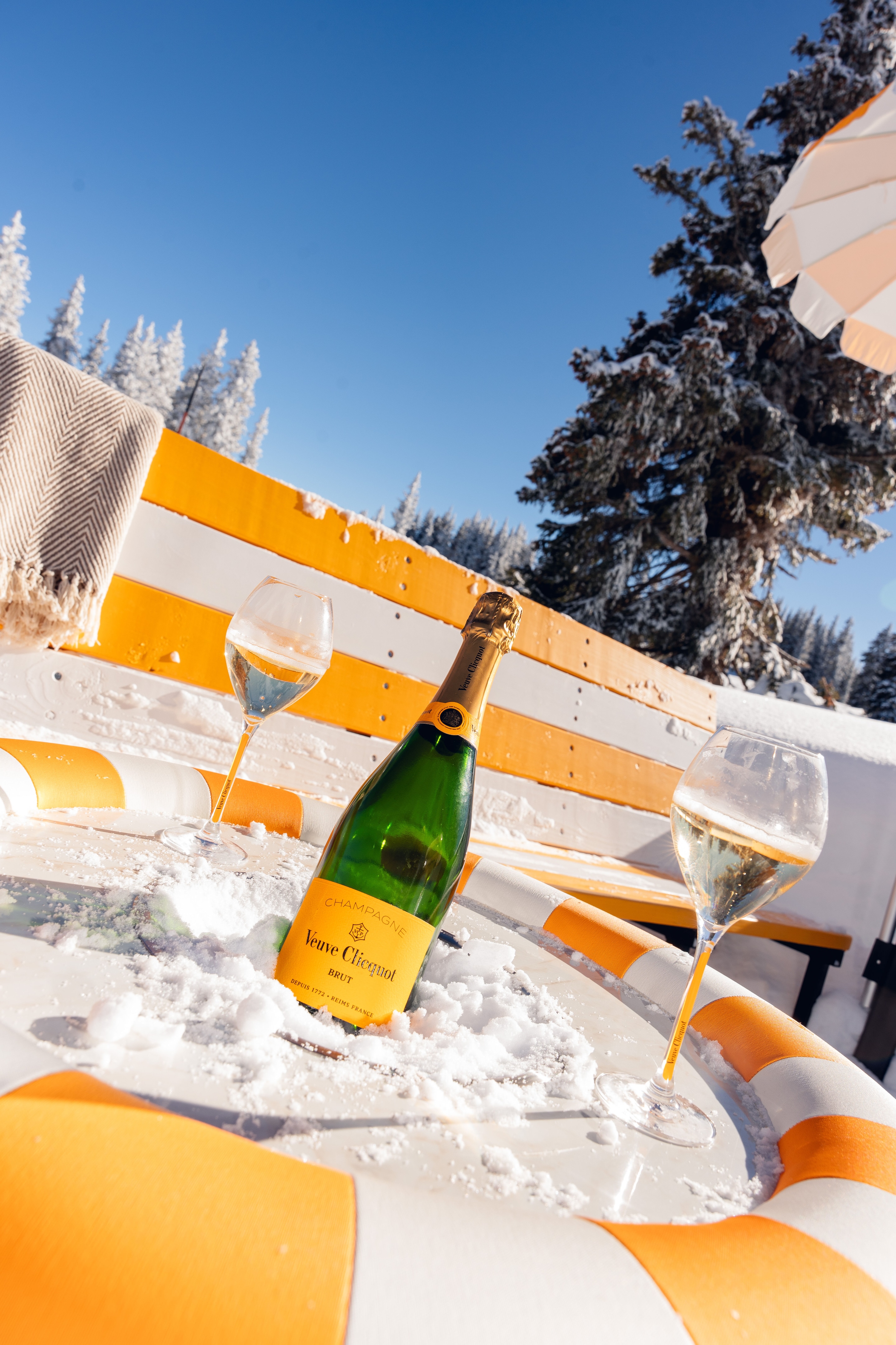 Bottle of Veuve Clicquot yellow label champagne in ice bucket